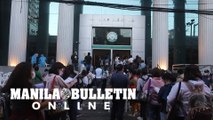 Aspiring lawyers form a long line in Manila to take their first day of Bar Exam