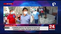 Cercado de Lima: Comerciantes derriban muro para entrar a galería clausurada