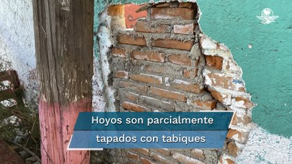Tapan a medias hoyos en bardas de panteón