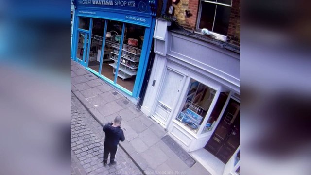 Yodel driver throws parcel onto window ledge