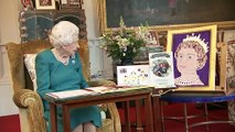 Queen beams at Jubilee well-wishes - and pet dog joins in!