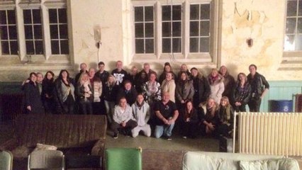 They Took This Group Photo At An Abandoned Asylum... But One Detail Made Their Blood Run Cold