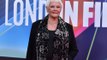 Does Dame Judi Dench approve of the idea of a female James Bond?