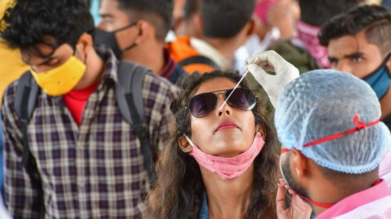 India's daily Covid-19 cases drop below 1 lakh