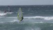 People Enjoy WindSurfing On Sea Waves