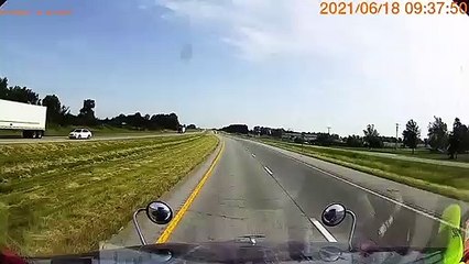Driver on Wrong Side of the Road Almost Hit by Semi