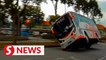 Dashcam captures moment bus skids and flips on its side in Nilai