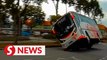 Dashcam captures moment bus skids and flips on its side in Nilai