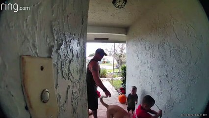 Dad Helps Kids Move Iguana