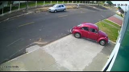 Bicyclist Carries Bike Away After Crashing into Car