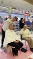 Ann Earnshaw gets her head shaved at Coles Bega