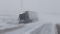 Trucks stranded on I-94 as blizzard causes whiteout conditions