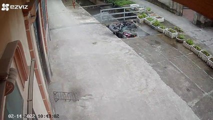 Man Transporting Heavy Load Falls Through Concrete