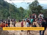 Pasukan penyelamat guna tangan korek tanah keluarkan mangsa