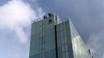 Radisson Blu hotel in Bristol - response teams abseil down building to make repairs