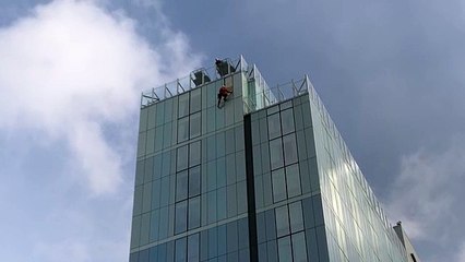 Radisson Blu hotel in Bristol - response teams abseil down building to make repairs