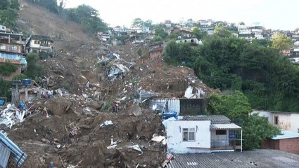 Search for missing continues after storm leaves at least 100 dead