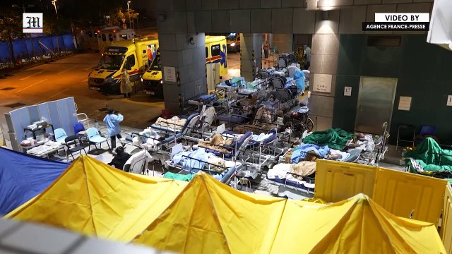 Patients outdoors in the cold as Hong Kong hospital buckles under Omicron wave