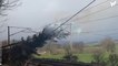 Tree bursts into flames after falling onto railway power line in storm winds