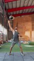 Fitness Professional Swings And Juggles Heavy Kettlebell With One Hand