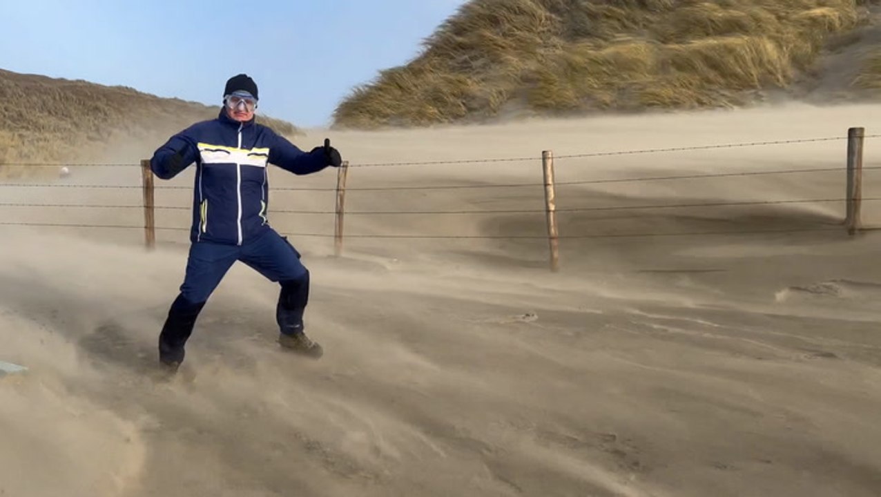 Dutch thrillseekers brace against the strong winds of Eunice