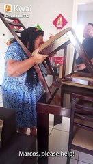 Husband Helps Wife Remove Stuck Chair