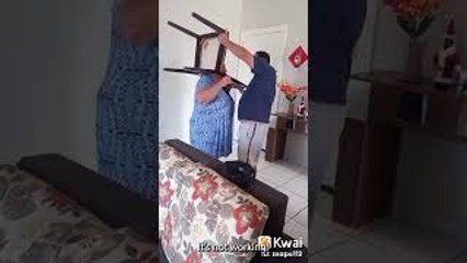 Husband Helps Wife Remove Stuck Chair