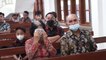 Elderly Woman Wipes Her Tears With Her Mask in Church
