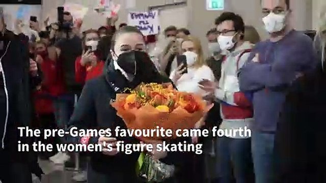 Beijing 2022 Fans greeting figure skater Kamila Valieva at Moscow airport AFP