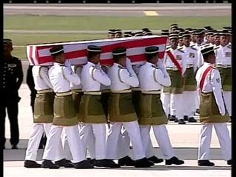 First two coffins carried to hearses