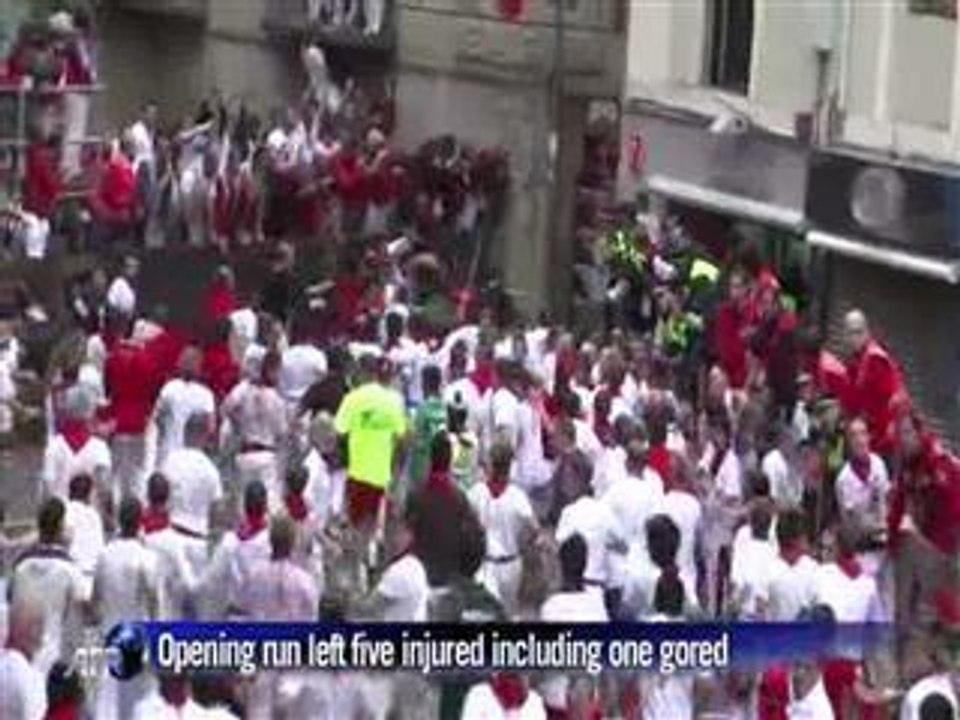 Men vs bulls on slippery cobbled streets of Pam...