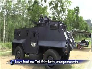 Checkpoints erected after graves found near Thai border