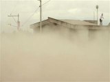 Volcano spews heavy layer of ash over local towns