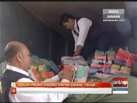 Sebuah premis diserbu simpan barang tiruan