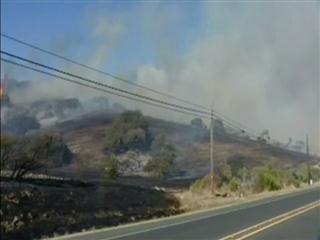 Thousands of evacuees head home as California blazes near containment