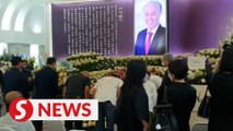 Family members and friends pay respects to the late Tan Kai Hee