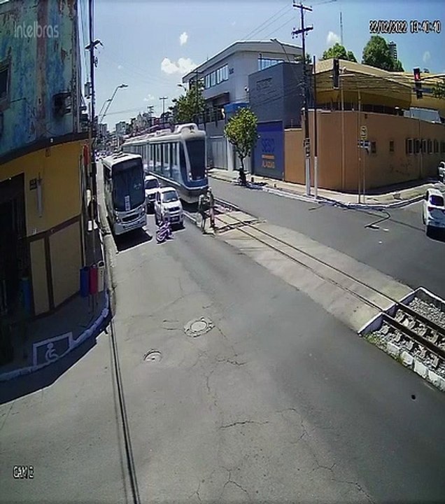 Biker Saves Old Lady Standing in the Tram Tracks