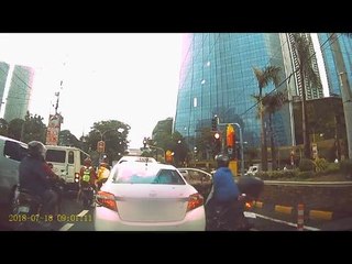 This dashcam footage shows why passengers should look before opening car doors in traffic