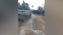 Civilians appear to block Russian tank from entering town in northern Ukraine