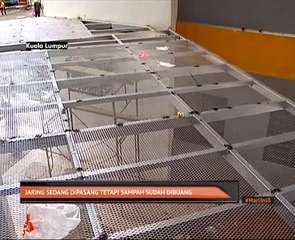 Jaring sedang dipasang tetapi sampah sudah dibuang