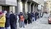 Russians queue to withdraw money amid growing fears about impact of sanctions on economy