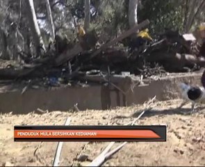 Banjir lumpur: Penduduk mula bersihkan kediaman