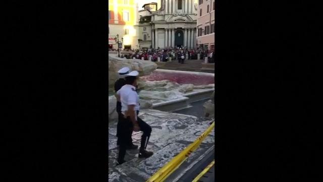 Rome's Trevi fountain runs red after man pours dye in water
