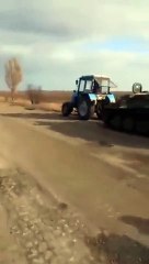 Ukrainian tractor steals Russian APC