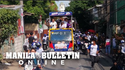 Aksyon Demokratiko candidates wave to the crowd in Malabon City