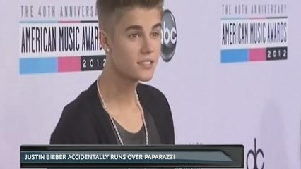 Justin Bieber accidentally runs over papparazzi