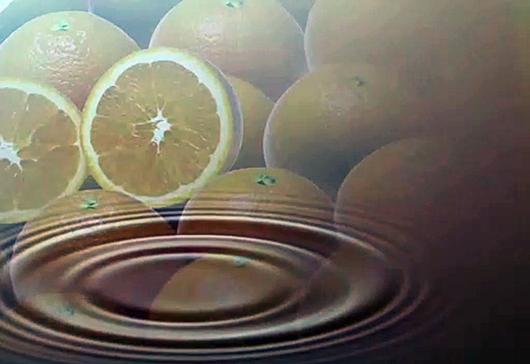 Citrus fruit juice drop falling with citrus in background