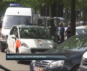Belgium police raids after station attack