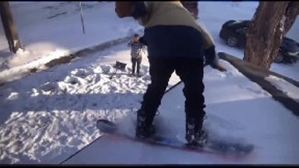 Guy Sending it off Roof with Snowboard Crashes