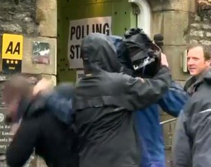 Media scuffles outside polling station during UK election